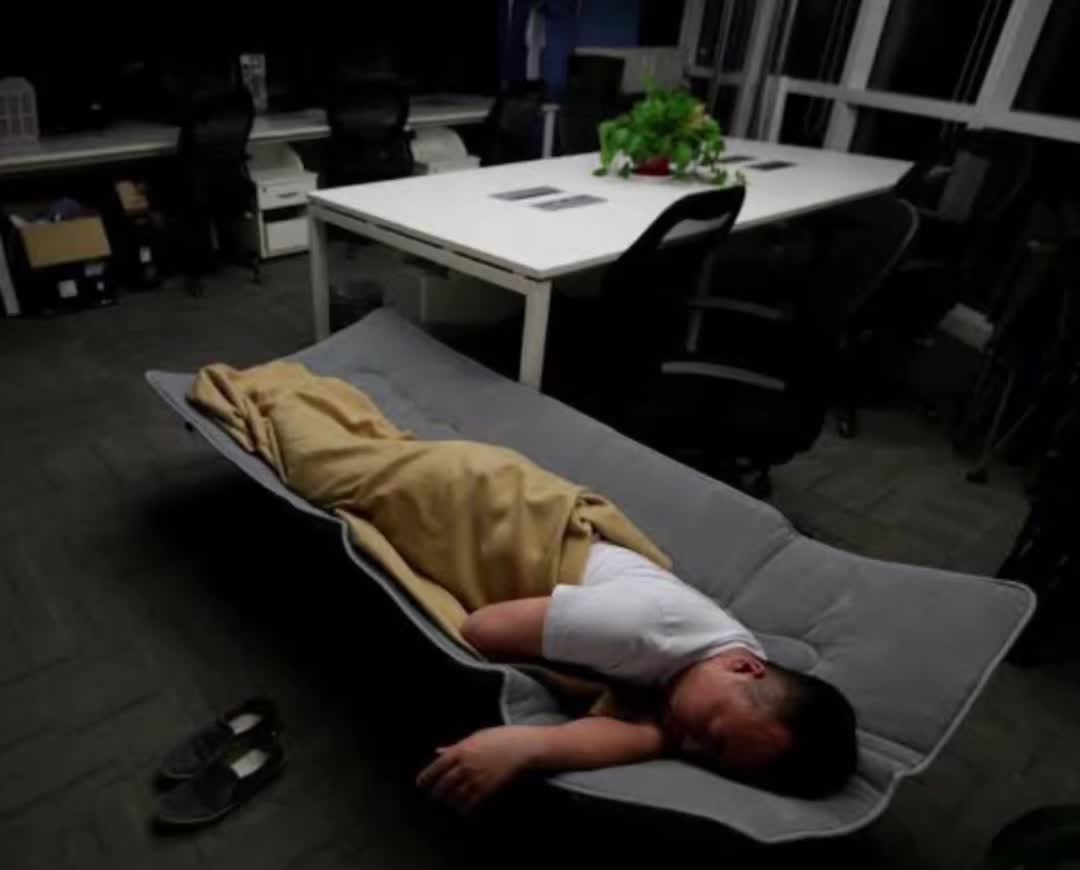 Elon sleeping in factory couch